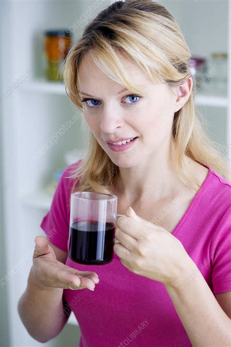 Woman With Hot Drink Stock Image C021 8722 Science Photo Library