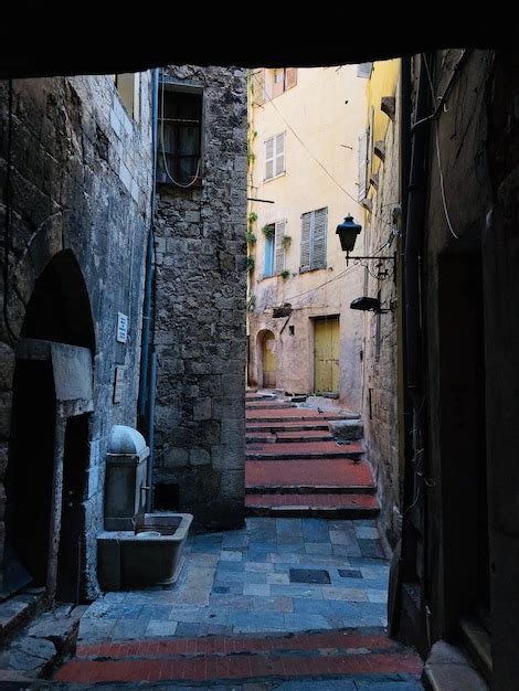 Premium Photo Alley Amidst Buildings In City
