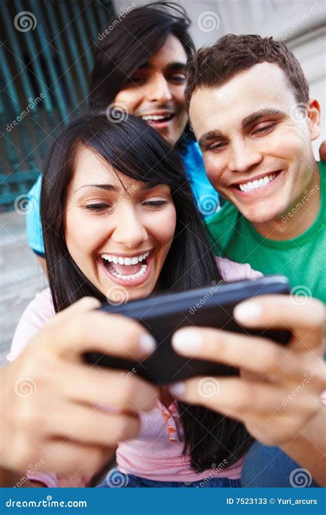 Group Of Young Friends Laughing At Cellphone Stock Image Image Of