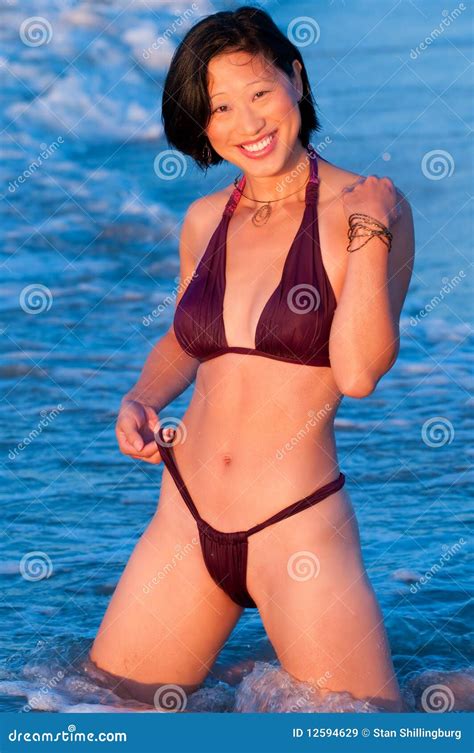 Attractive Smiling Asian Woman In Bikini Royalty Free Stock Images