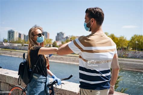 Young Couple Handshaking With Elbows During A Coronavirus Pandemic High-Res Stock Photo - Getty ...