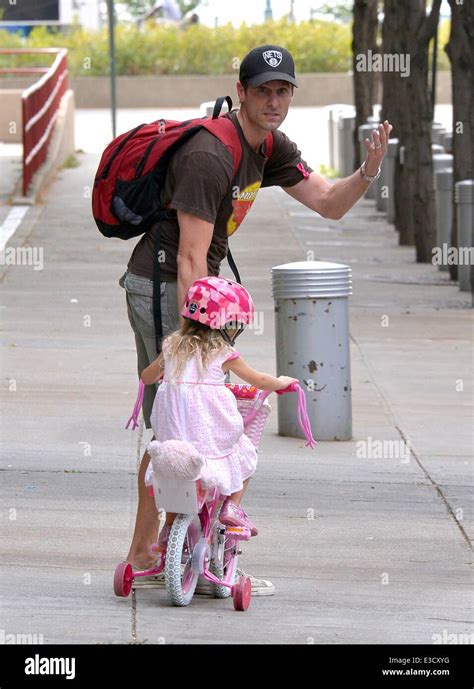 Jason Hoppy takes his daughter Bryne Hoppy for a bike ride on her pink ...