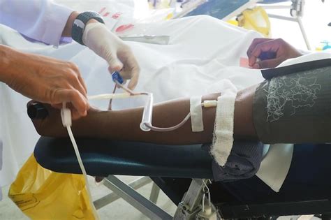 Premium Photo Cropped Hands Of Doctor Examining Patient In Hospital