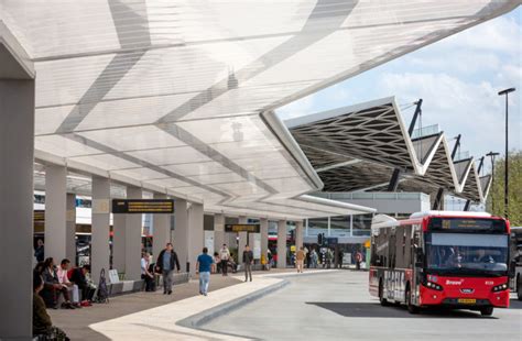 A Bus Station Awning By Day Solar Powered Lighting Element At Night