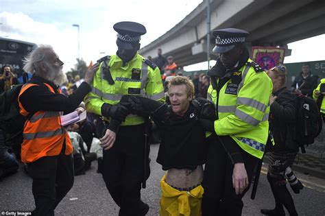 Police Drag Extinction Rebellion Campaigners From London City Airport