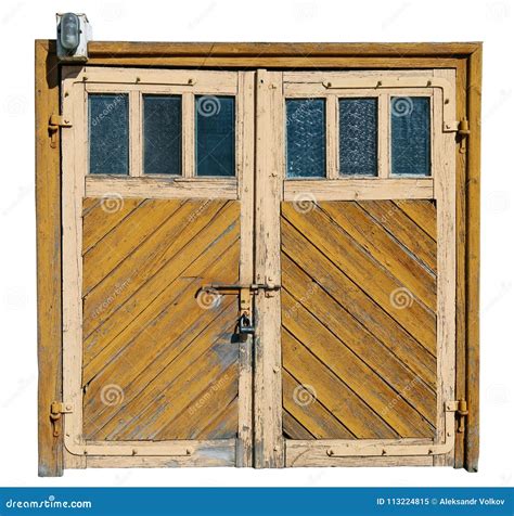 Vintage Yellow Wooden Garage Doors With Glass Windows Stock Image