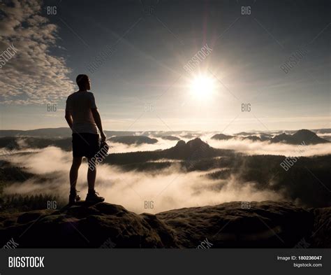 Man Top Mountain Looking Misty Image Photo Bigstock