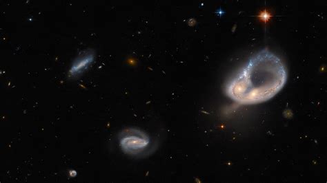 Hubble Telescope Captures Dazzling Embrace Of Merging Galaxies Space