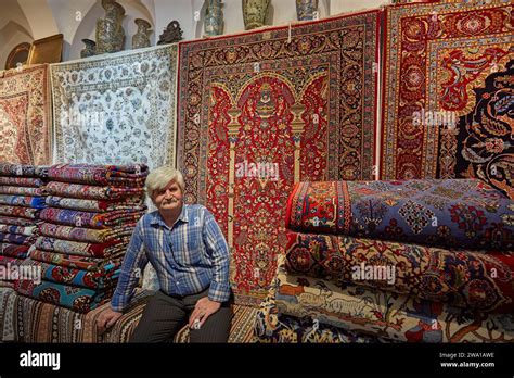 Persian Carpet Seller In His Shop In The Aminoddole Caravanserai