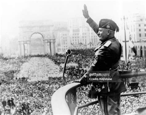 Italian Dictactor Benito Mussolini Saluting During A Public Address