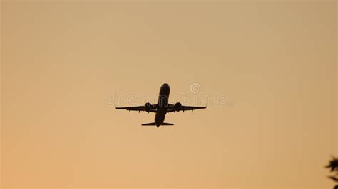 Airplane Flying At Sunset In Orange Sky Stock Video Video Of Aviation