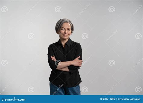 Pretty Mid Aged Grey Haired Woman In Black Shirt Isolated On Grey