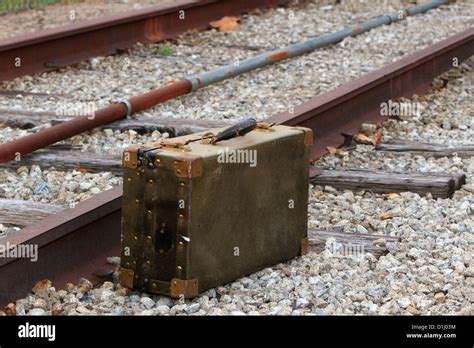 Old Travel Suitcase By The Side Of The Railroad Tracks Stock Photo Alamy
