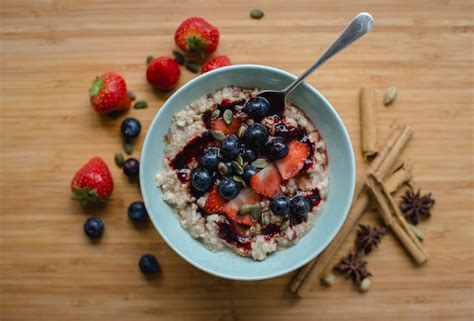 Oat Porridge With Homemade Elderberry Syrup And Toasted Pumpkin Seeds