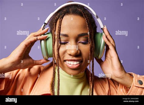 Pretty African American Woman In Vibrant Attire With Wireless