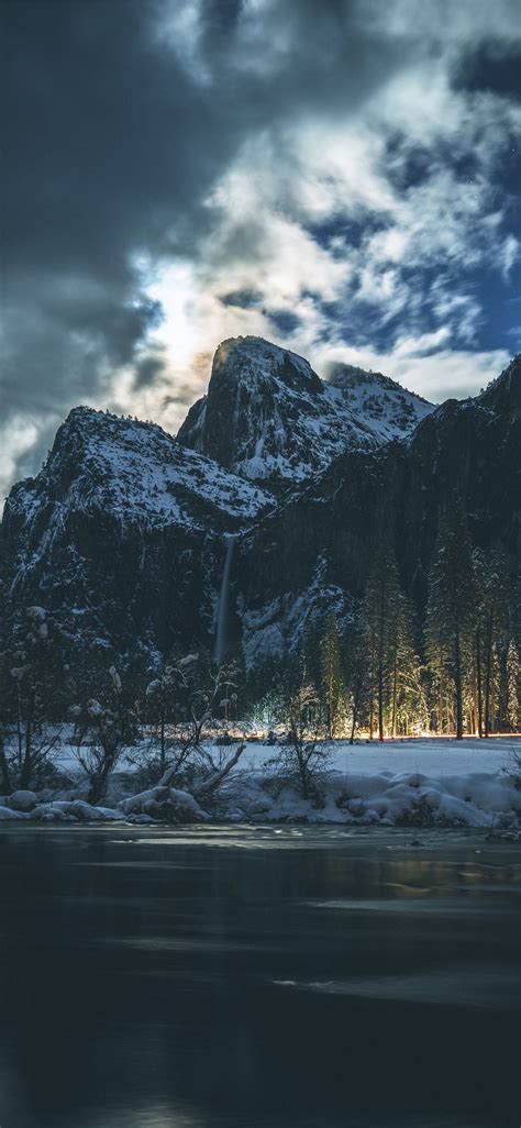 Landscape Photography Of Mountain Under White Sky Iphone X Wallpapers