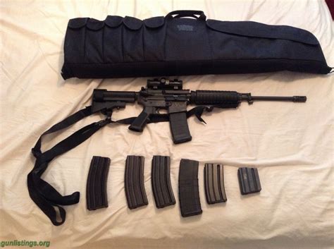 Gunlistings.org - Rifles Bushmaster AR 15 With Red Dot Scope