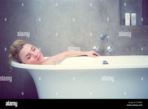 Serene Blonde Lying In The Bath Stock Photo Alamy