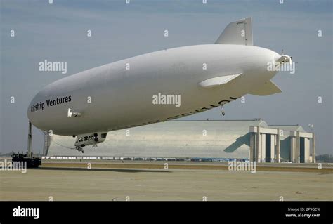 The Air Ventures Zeppelin Is Towed Back To Its Hangar In The Background