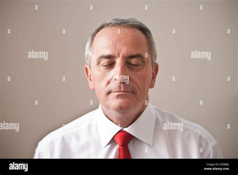 Portrait Of Man With Eyes Closed Stock Photo Alamy