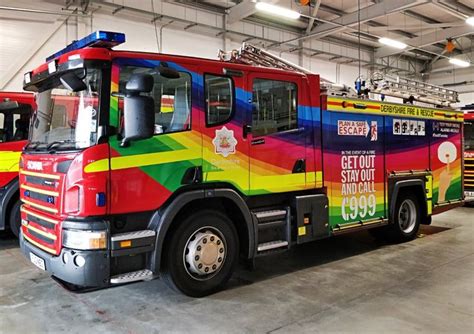 Brightly Colored Fire Trucks In Garage