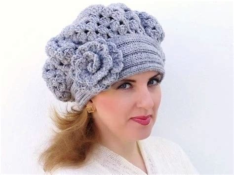 A Woman Wearing A Gray Crochet Hat With Flowers