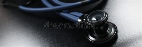 Doctor Stethoscope Equipment On Dark Surface Tool For Patient