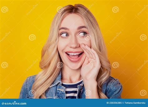 Portrait Of Interested Smart Girl Hand Open Mouth Tell Secret Look Blank Space On Yellow