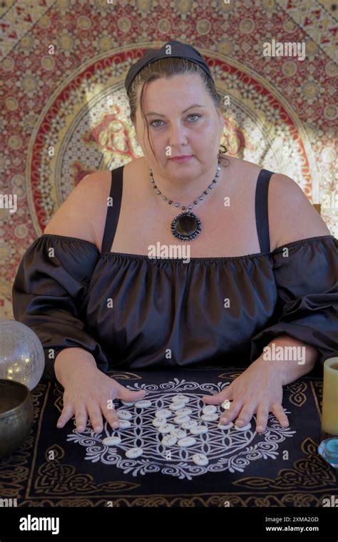 A Gypsy Fortune Teller Dressed In Black Predicts The Future With Rune
