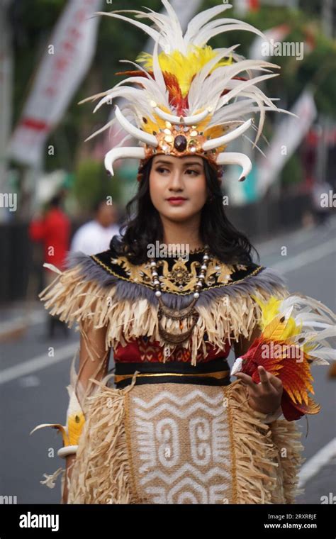 Indonesian with a traditional costume from papua at BEN Carnival Stock ...