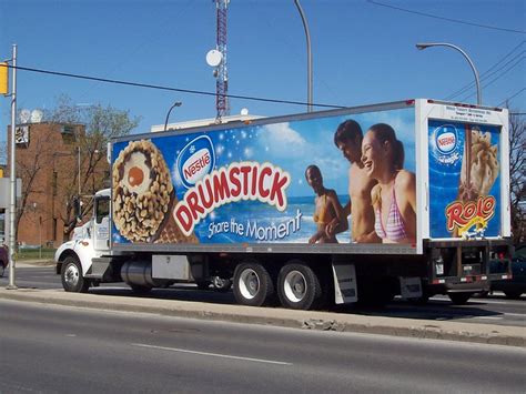 A Refrigerated Truck Advertising Nestlé Drumstick And Rolo Ice Cream