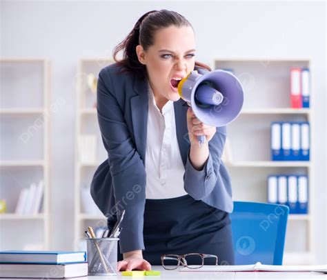 The Angry Businesswoman Yelling With Loudspeaker In Office Angry