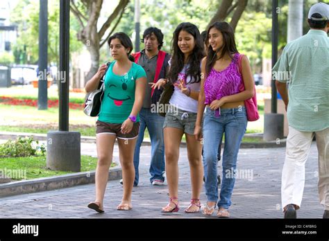 Teenage Peruvian Girls Walking In Central Park Of The Miraflores