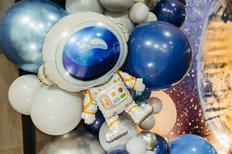 White Astronaut Toy on the Table · Free Stock Photo