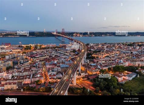 Aerial View Of April Th Bridge With Christ The King Statue Cristo