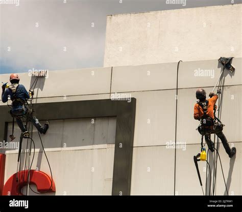 Men Cleaning A High Rise Building Stock Photo Alamy