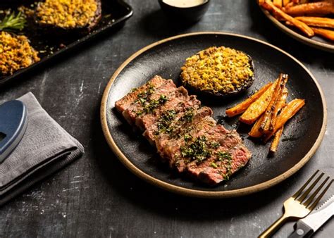 Sirloin Steak With Pink Peppercorn Sauce And Herb Crusted Portobello