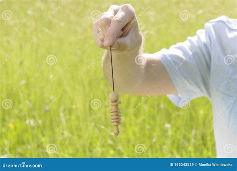 Using Big Wooden Pendulum Stock Image Image Of Hand 195243559