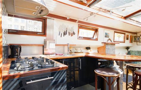 10 Stunning Houseboats Airbnbs On Amsterdam Canals - ItsAllBee | Solo Travel & Adventure Tips