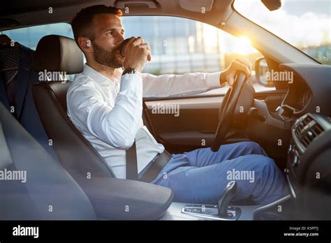 Man Drinking Coffee Driving Car Hi Res Stock Photography And Images Alamy