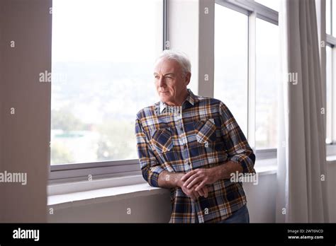 Thinking Mature Man And Smile In Home Window With Memory Moment And