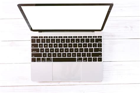 Premium Photo Top View Of Laptop Computer With Blank Screens On White Office Wooden Desk Table