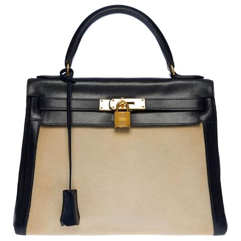 Hermès SAC À MAIN HERMES KELLY 28 RETOURNE BI MATIERE EN CUIR BOX