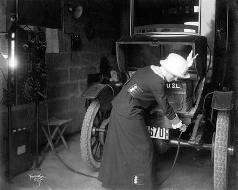 A Woman Named Charlotte Shipley Charges Her Electric Cars Battery In