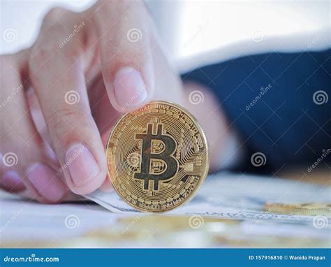 Close Up Hand Businessman Holding Golden Digital Bitcoin Stock Photo