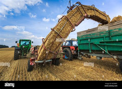 Tractors Working On A Farm Field Agricultural Machines At Work Stock