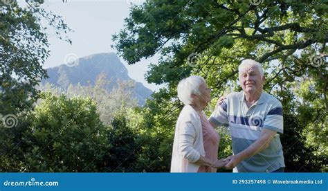 Happy Senior Caucasian Couple Dancing In Sunny Garden Slow Motion Copy Space Stock Footage