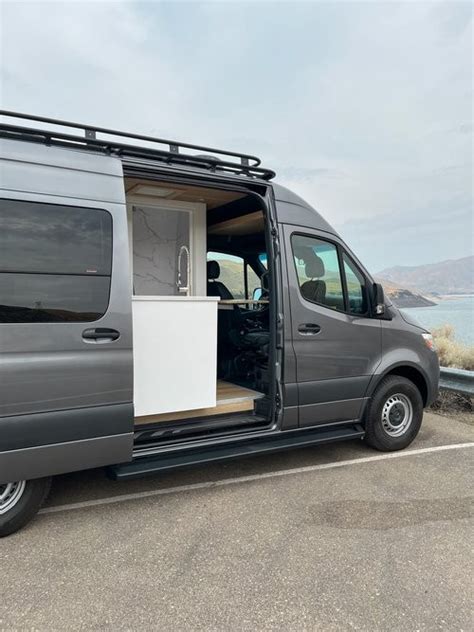 Couple Converts Sprinter Van Into A Functional Mini Beach House On