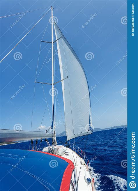 Sailing Ship Yachts With White Sails In The Open Sea Stock Photo