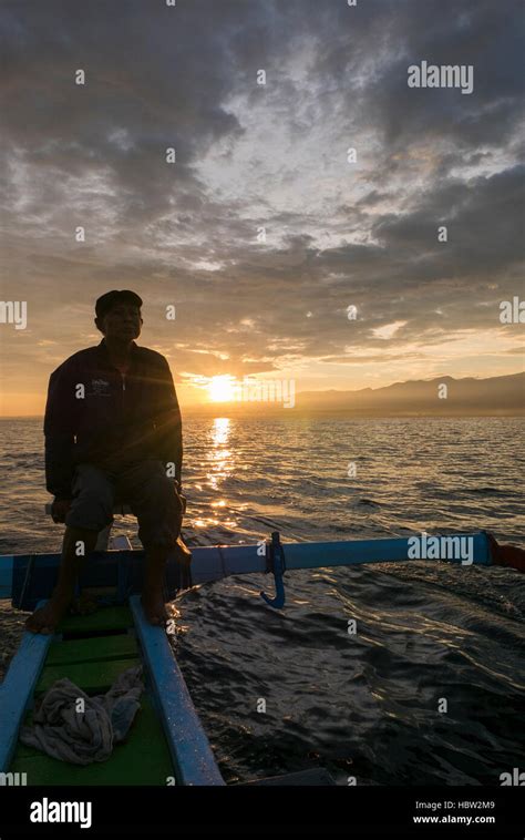 Fisher Man Traditional Wooden Boat And Ocean View During Sunrise In